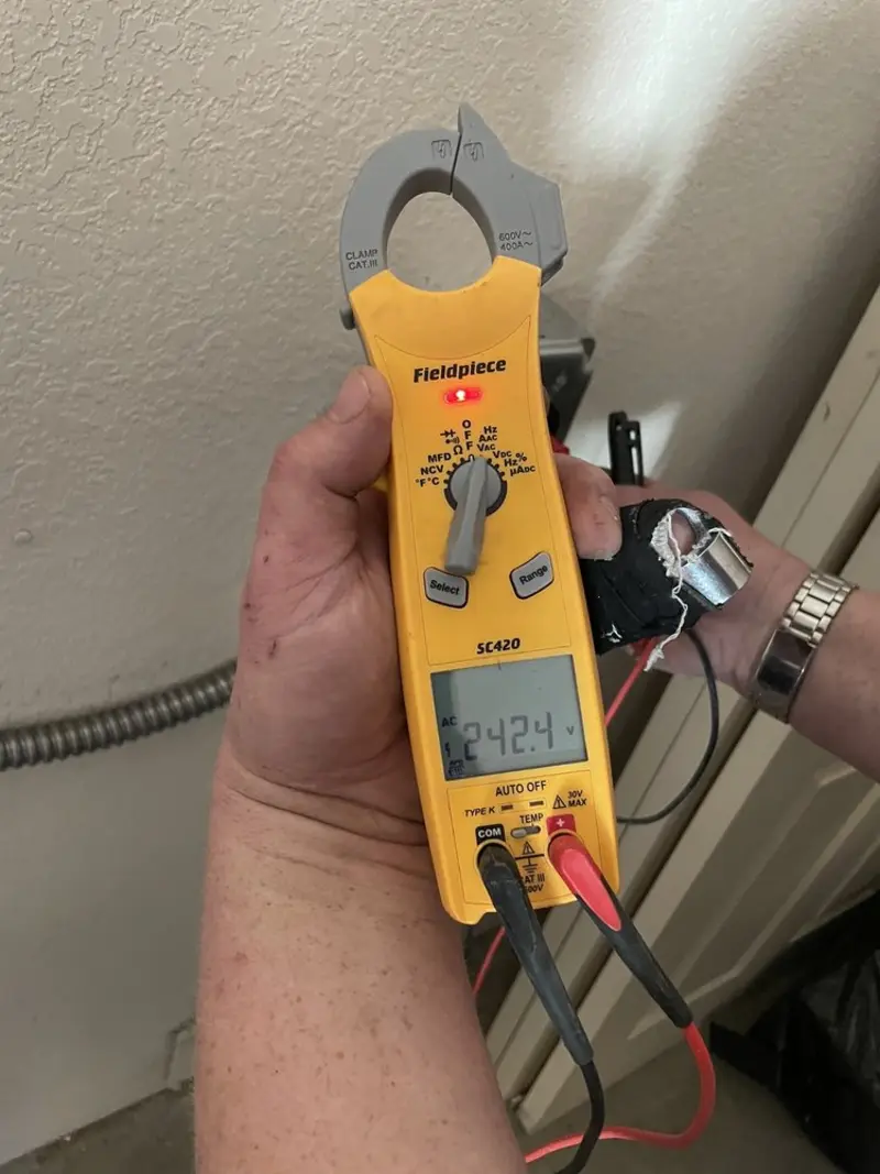 Voltage testing with clamp meter during Hot Tub / Pool Electrical Wiring in Bellefontaine Neighbors